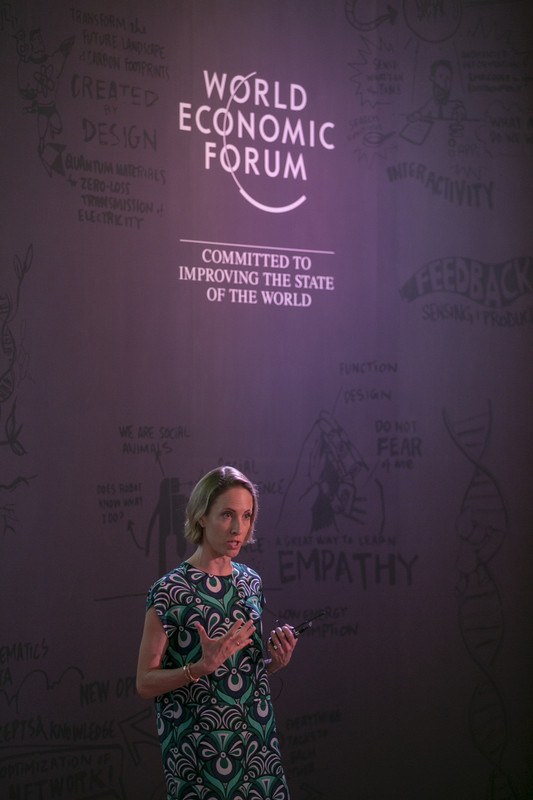 Laure de Preux speaking on stage at a World Economic Forum event